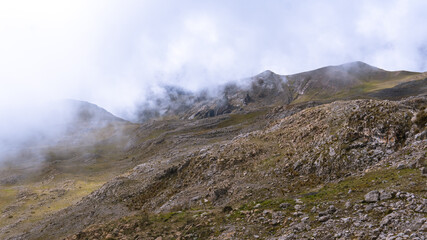 view of how the sun's rays pierce the clouds and the mist of the cold Andes of Peru
