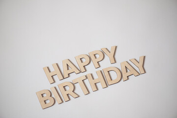 Wooden letters on a background. Congratulations with birth day