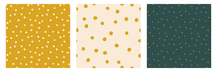 Polka dot seamless patterns. Set of vector backgrounds with random dots. Trendy colors green, golden, pastel beige. Card templates.
