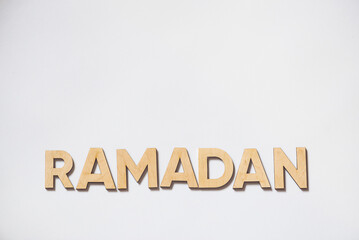 Ramadan. Wooden letters on white background.