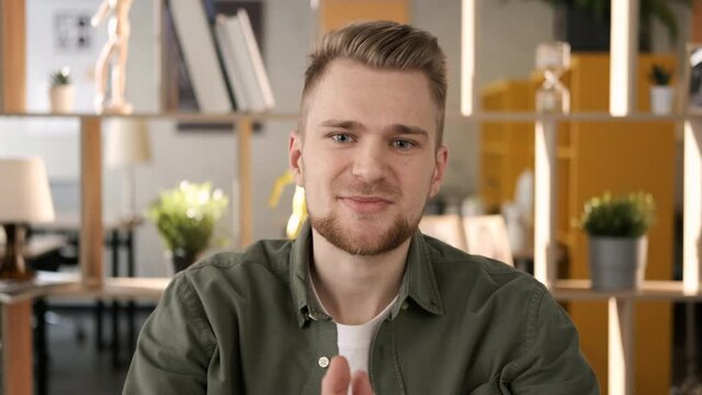 Remote communication with friends. Happy man having online video chat conference. Webcam view. Working from home during the pandemic. Online education and training. Portrait bearded male student