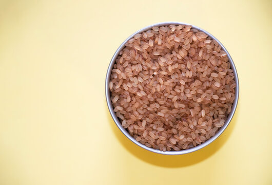 Kerala Special Matta Rice In Yellow Background