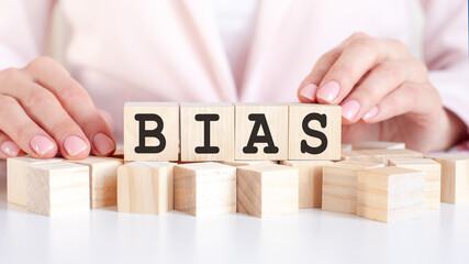 woman made word BIAS with wooden blocks