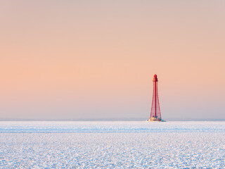 red tower of metal lighthouse under pink sky in sunset with copy space - Powered by Adobe