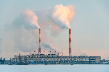 Chimney smoking stack. Air pollution and climate change. Emission to air atmosphere from industrial factory chimney