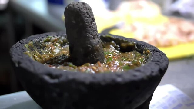 Close-up of traditional Mexican molcajete full of sauce