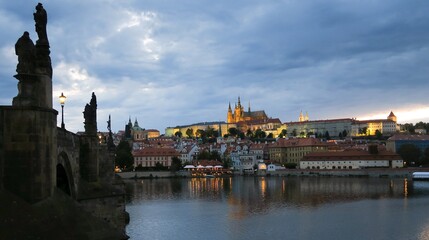 evening view of Prague Castle with the Vltava River from Charles Bridge in Prague Czech Republic