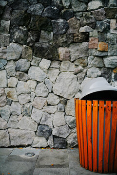 stone wall with wooden bin