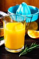 A glass of freshly squeezed orange juice. Close-up, daylight