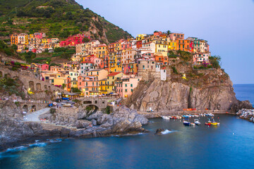 Colorful villages in Cinque terre, Italy and seascape at sunset