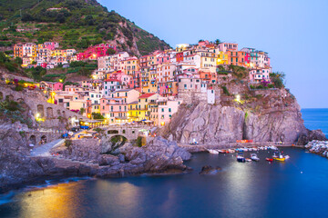 Colorful villages in Cinque terre, Italy and seascape at sunset