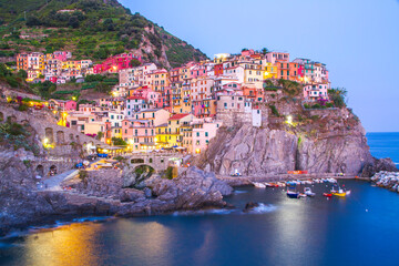 Colorful villages in Cinque terre, Italy and seascape at sunset