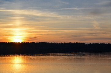 Orange sunset over the lake. Selective focus.