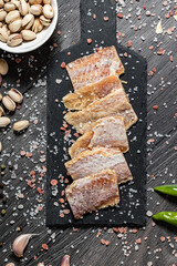 Dried fish on a wooden background. Different kinds of dried fish