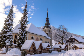 Fototapeta na wymiar Alpine Village in Kranjska Gora with ski resorts and slopes, Slovenia