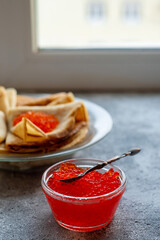 Russian traditional Maslenitsa: pancakes with red caviar