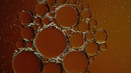 Oil bubbles in the water with some gradient backlight