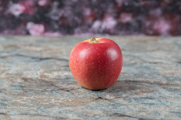 Juicy apple isolated on a concrete marble background