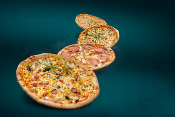 Floating, smoking pizzas on a turquoise background