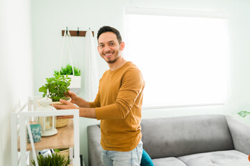 Attractive man in his 30s proud of his gardening hobby