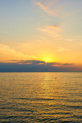 Amazing Sunset on the Sea. Adriatic sea, beautiful sunset, waves and landscape.  Lignano Sabbiadoro, Italy.