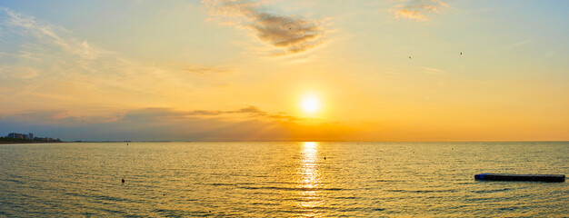 Amazing Sunset on the Sea. Adriatic sea, beautiful sunset, waves and landscape.  Lignano Sabbiadoro, Italy.