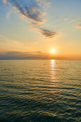 Amazing Sunset on the Sea. Adriatic sea, beautiful sunset, waves and landscape.  Lignano Sabbiadoro, Italy.
