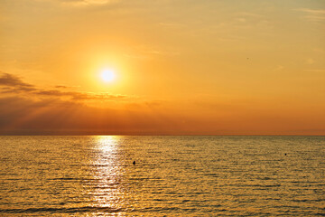 Amazing Sunset on the Sea. Adriatic sea, beautiful sunset, waves and landscape.  Lignano Sabbiadoro, Italy.