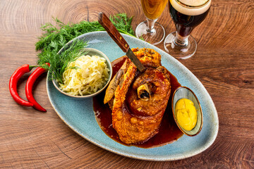 Baked pork knee, pork knuckle and sauerkraut.