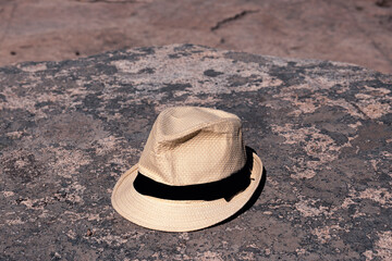 Straw hat leaning on a rock