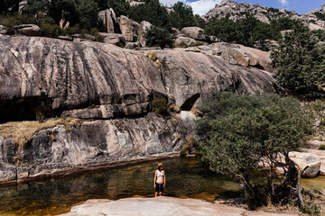 Woman in a river in the mountains