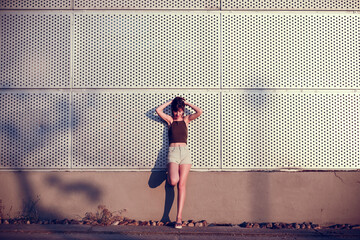 Supported woman combing her hair