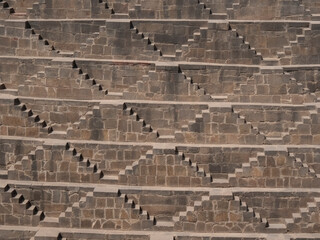 close up of steps at chand baori, a stepwell at the village of abhaneri in the india