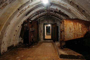 Fototapeta na wymiar Dark abandoned Soviet bunker, echo of Cold War