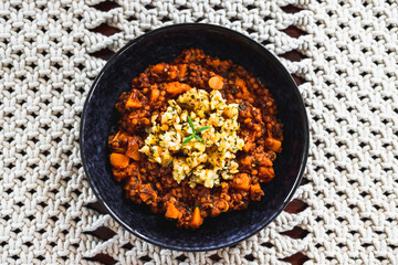vegan pumpkin lentil and mushroom curry with truffle potato topping, healthy plant-based food