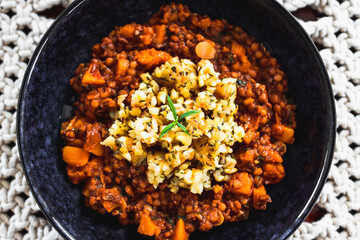 vegan pumpkin lentil and mushroom curry with truffle potato topping, healthy plant-based food