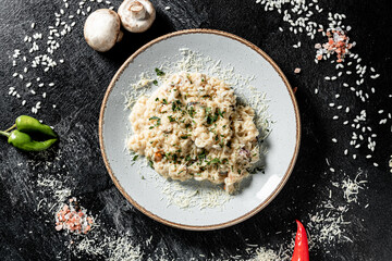 risotto with seafoods (shrimps, mussels, octopus, clams) and tomatoes
