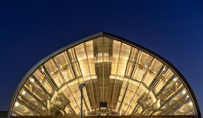 Modern train station glas roof at blue hour