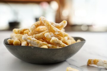 Sweet Sev Seerni or Madhura seva - Indian deep fried sweet made of chickpea flour, selective focus
