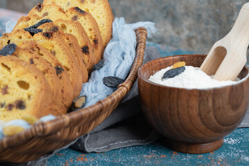 Sliced sultana pie in a rustic wooden basket