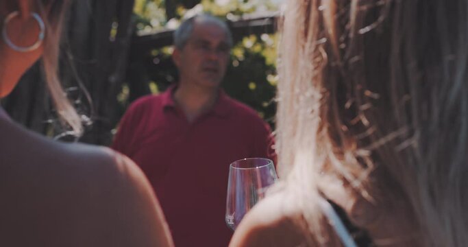 A winemaker guiding private tour for a group of friends