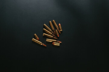 Bullet isolated on black background. Rifle pistol bullets close-up. Cartridges for pistol and carbine.