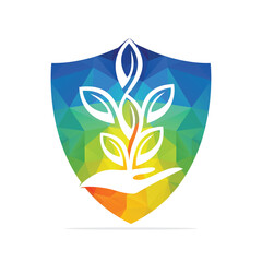 Plant in Hand Vector Logo Design. Natural Products in Shield Shape. Cosmetics and Spa logo.	
