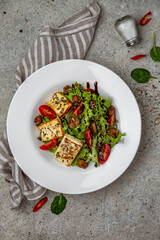 Fresh vegetable salad: tomatoes, cucumbers, olives, chicken. Healthy balanced dietary nutritious food.