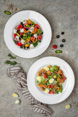 Fresh vegetable salad: tomatoes, cucumbers, olives, chicken. Healthy balanced dietary nutritious food.