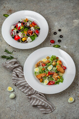 Fresh vegetable salad: tomatoes, cucumbers, olives, chicken. Healthy balanced dietary nutritious food.