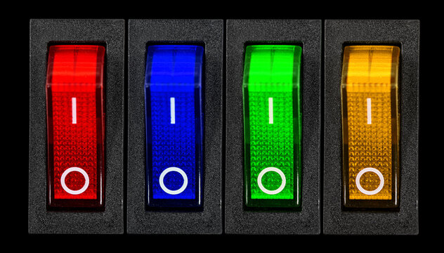 Red, blue, green and yellow power switches at OF position, isolated on black background