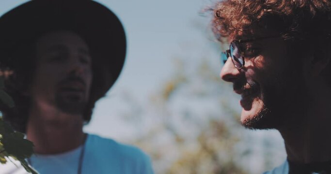 Two young men talking in a sunny day 