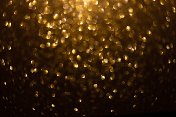 gold sparkling background bokeh. Elegant gold background with glitter sparkle bokeh