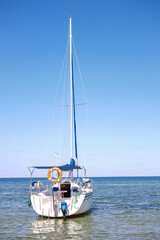 Bautiful motor boat along in the  Black sea clear blue  water near island in Skadovsk Region, Kherson Oblast near Crimea. Europe.  Tourism high season, hot summer weather